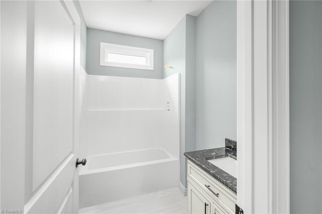 bathroom featuring vanity and bathing tub / shower combination