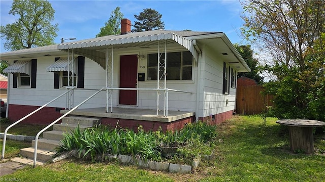 bungalow featuring crawl space, a chimney, and fence