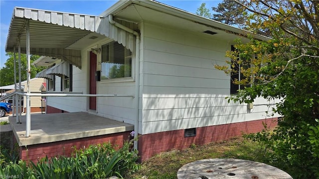 view of side of home with crawl space