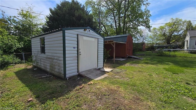 view of shed with a fenced backyard