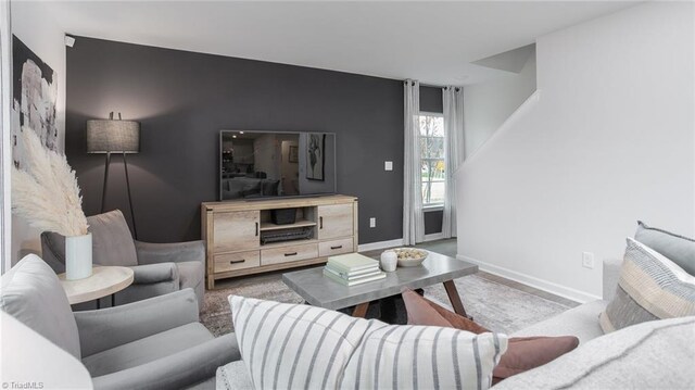 162 W Farm Loop, Stokesdale, NC 27537 - living room with an accent wall and baseboards