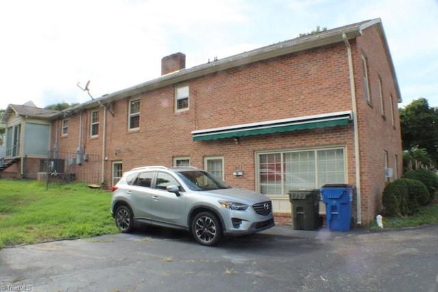 rear view of house with a lawn