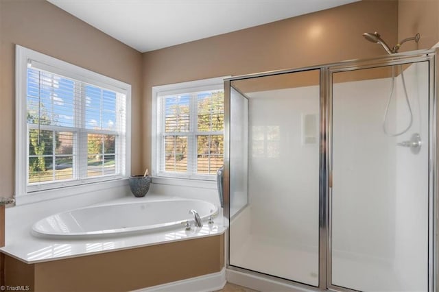 bathroom with shower with separate bathtub