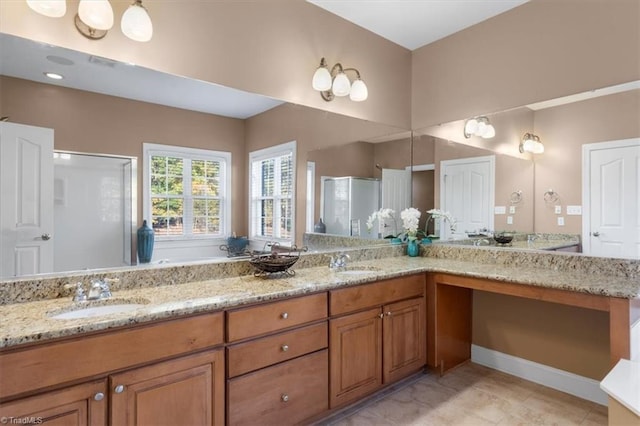 bathroom with tile patterned flooring, vanity, and walk in shower