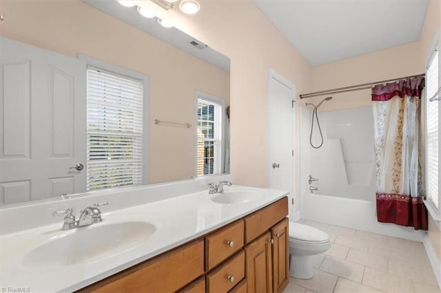 full bathroom featuring tile patterned flooring, vanity, toilet, and shower / bathtub combination with curtain