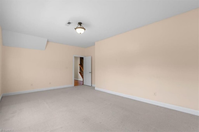 unfurnished room with light carpet