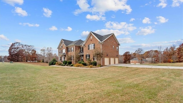 view of front of house with a garage and a front yard