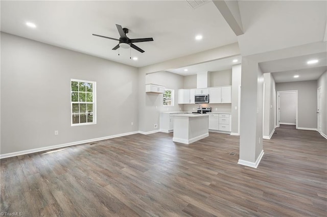2500 Lomond St, Winston-Salem, NC 27127 - unfurnished living room featuring healthy amount of natural light, a ceiling fan, dark wood-type flooring, and recessed lighting
