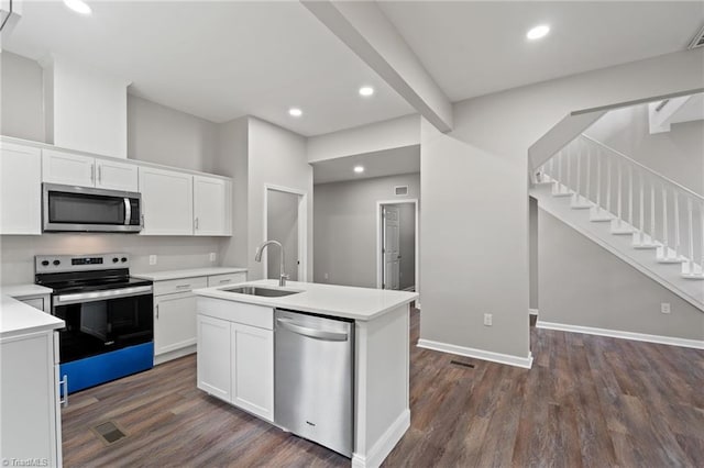 2500 Lomond St, Winston-Salem, NC 27127 - kitchen with stainless steel appliances, dark wood-style floors, white cabinets, light countertops, and recessed lighting