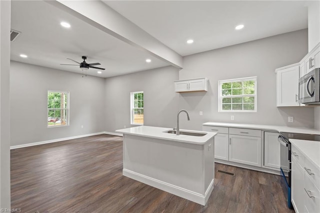 2500 Lomond St, Winston-Salem, NC 27127 - kitchen with stainless steel microwave, plenty of natural light, ceiling fan, dark wood-type flooring, and recessed lighting