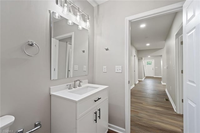 2500 Lomond St, Winston-Salem, NC 27127 - half bathroom with vanity, wood finished floors, and recessed lighting