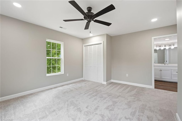 2500 Lomond St, Winston-Salem, NC 27127 - unfurnished bedroom featuring carpet flooring, recessed lighting, a closet, ensuite bath, and a ceiling fan