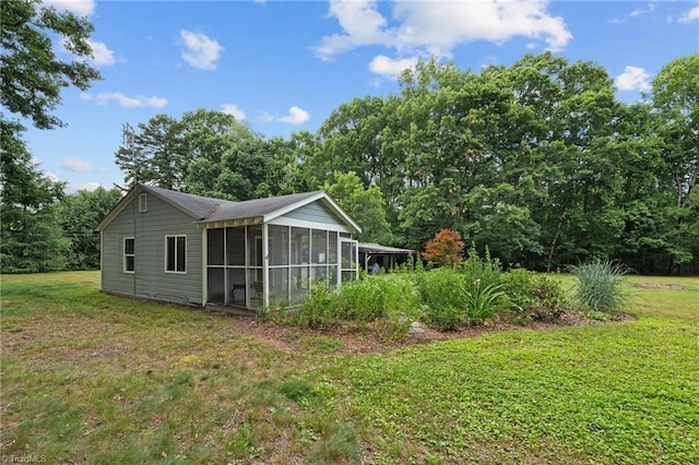 view of yard featuring a sunroom