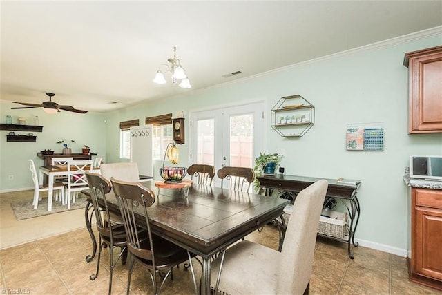 304 Walnut Crossing Dr, Whitsett, NC 27377 - dining space featuring crown molding, light tile patterned flooring, ceiling fan, baseboards, and a chandelier