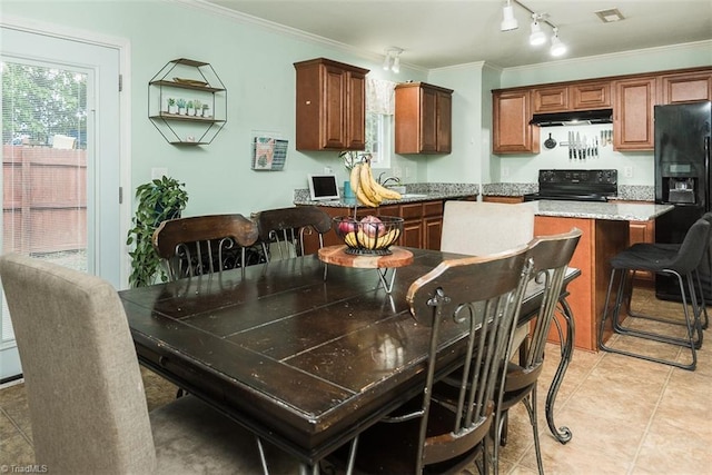 304 Walnut Crossing Dr, Whitsett, NC 27377 - dining room with ornamental molding, track lighting, and light tile patterned floors