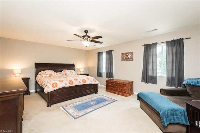 304 Walnut Crossing Dr, Whitsett, NC 27377 - bedroom featuring light carpet, multiple windows, and baseboards