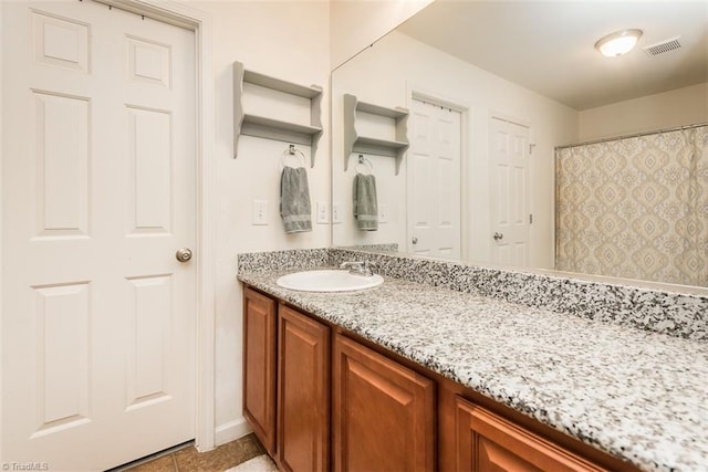 304 Walnut Crossing Dr, Whitsett, NC 27377 - full bath featuring vanity, tile patterned flooring, and baseboards