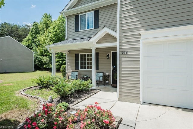 304 Walnut Crossing Dr, Whitsett, NC 27377 - entrance to property with a porch and a yard