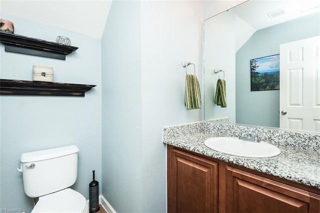 304 Walnut Crossing Dr, Whitsett, NC 27377 - half bathroom with toilet, vanity, and baseboards