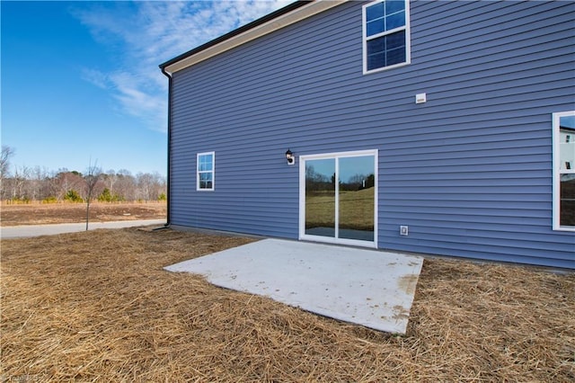 back of house with a patio area