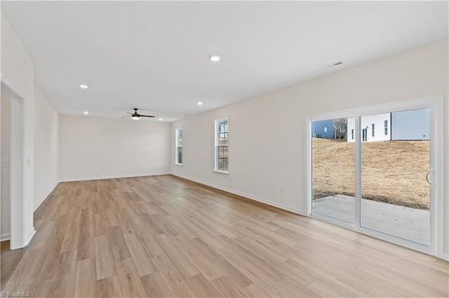 empty room featuring light wood finished floors, visible vents, recessed lighting, and ceiling fan