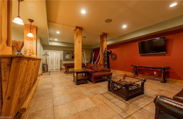 living room with ornate columns