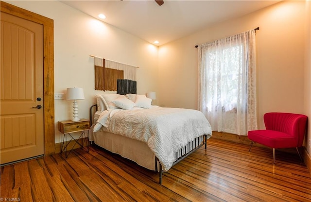 bedroom featuring dark hardwood / wood-style flooring and ceiling fan