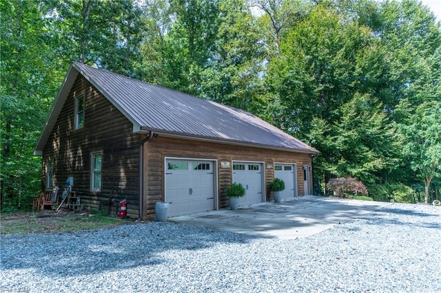 garage featuring wooden walls