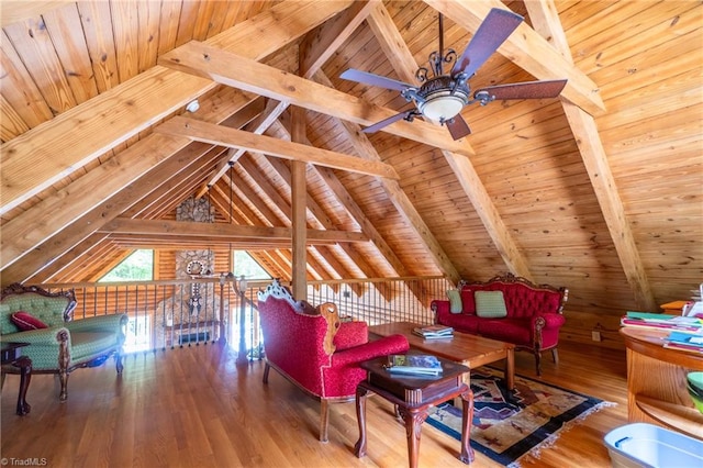 interior space with wooden ceiling, wood-type flooring, lofted ceiling with beams, and ceiling fan