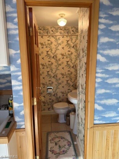 bathroom with tile floors and toilet