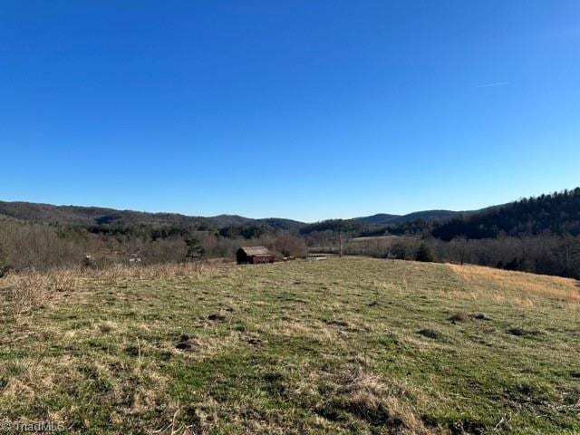 property view of mountains featuring a rural view