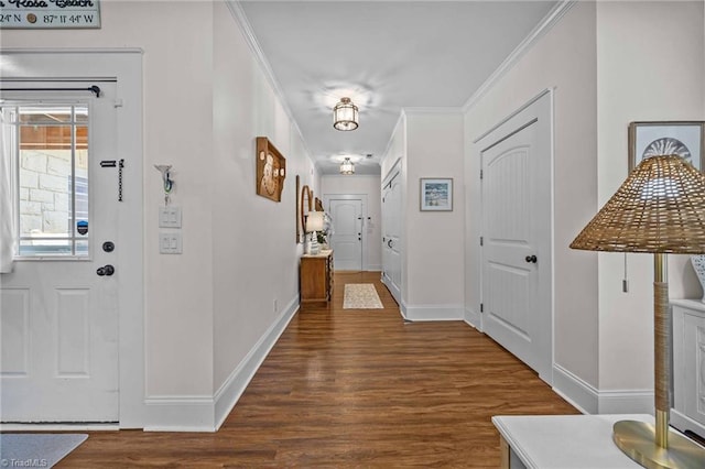 entrance foyer with crown molding, baseboards, and wood finished floors