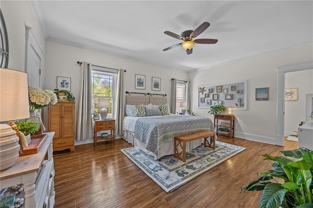 bedroom with ceiling fan, multiple windows, ornamental molding, and wood finished floors