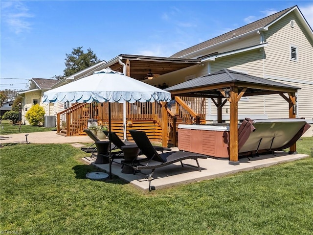 view of patio with a gazebo, central AC unit, ceiling fan, and stairway