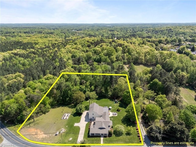 aerial view featuring a view of trees