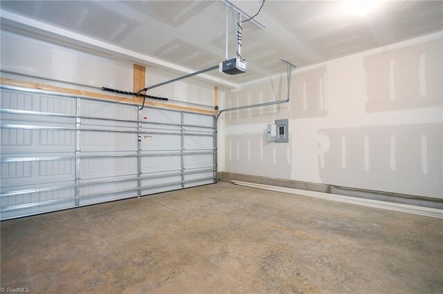 garage with electric panel and a garage door opener