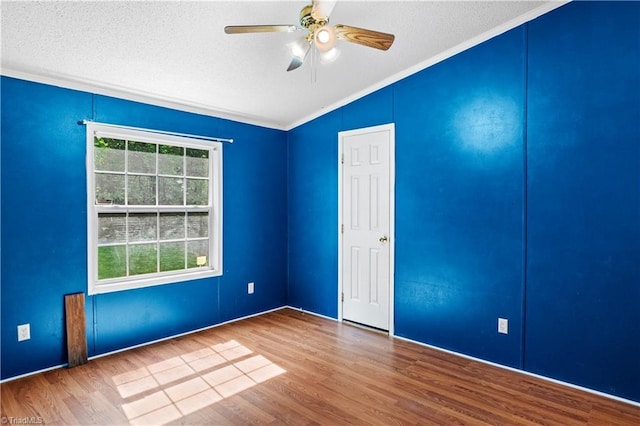 103 Forest Dr, King, NC 27021 - empty room featuring lofted ceiling, ornamental molding, a textured ceiling, wood finished floors, and ceiling fan