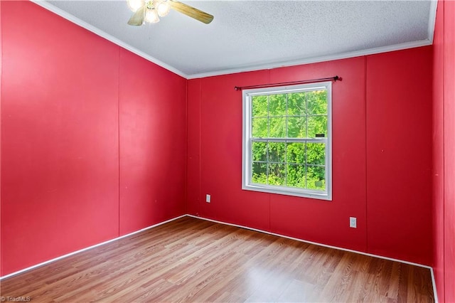 103 Forest Dr, King, NC 27021 - unfurnished room featuring wood finished floors, ceiling fan, crown molding, and a textured ceiling