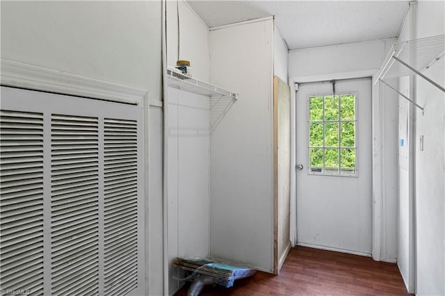 103 Forest Dr, King, NC 27021 - laundry room featuring a heating unit, wood finished floors, and a textured ceiling