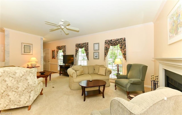 living room with crown molding, a ceiling fan, light carpet, and a fireplace