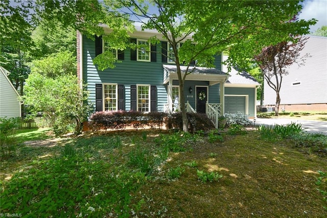 view of front facade with driveway and a garage