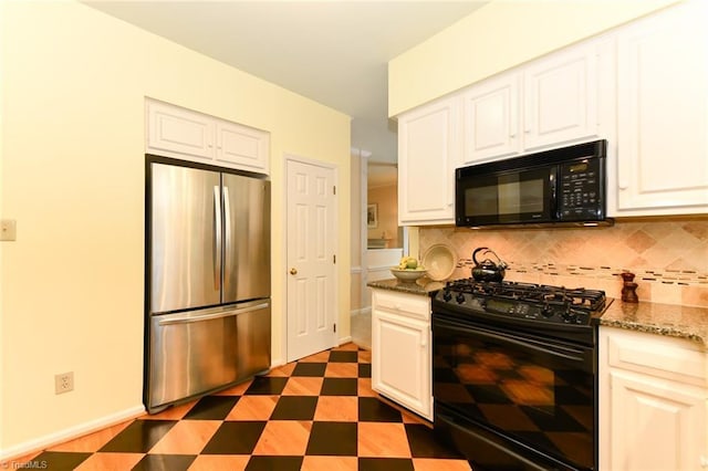 kitchen with stone counters, white cabinetry, decorative backsplash, and black appliances
