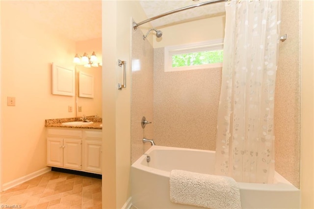 full bathroom featuring vanity, baseboards, and shower / bathtub combination with curtain