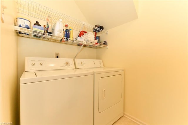 washroom featuring laundry area and washing machine and dryer