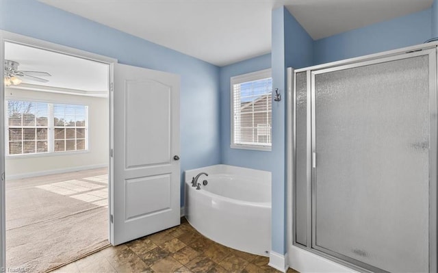 bathroom featuring ceiling fan and shower with separate bathtub