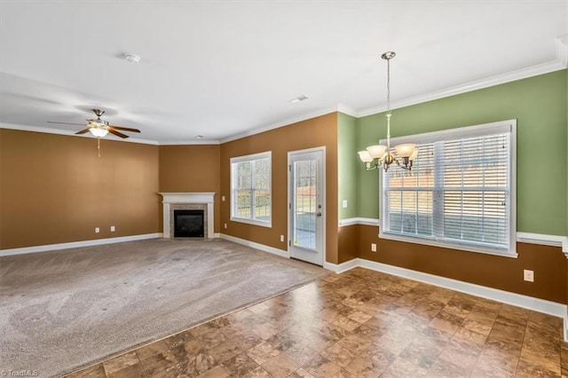 unfurnished living room with carpet flooring, crown molding, and ceiling fan with notable chandelier