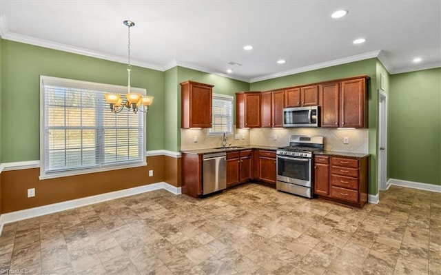 kitchen featuring an inviting chandelier, sink, pendant lighting, stainless steel appliances, and tasteful backsplash