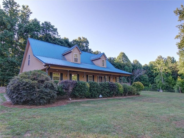 view of side of property with a lawn