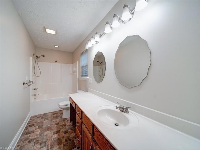 full bathroom featuring vanity, toilet, a textured ceiling, and shower / washtub combination