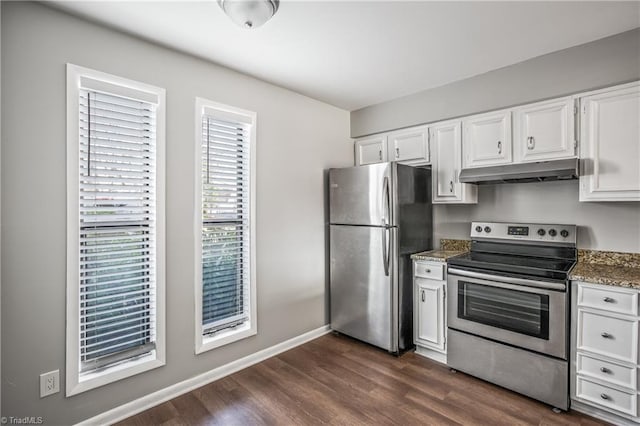 kitchen featuring baseboards, dark wood finished floors, stainless steel appliances, under cabinet range hood, and white cabinetry